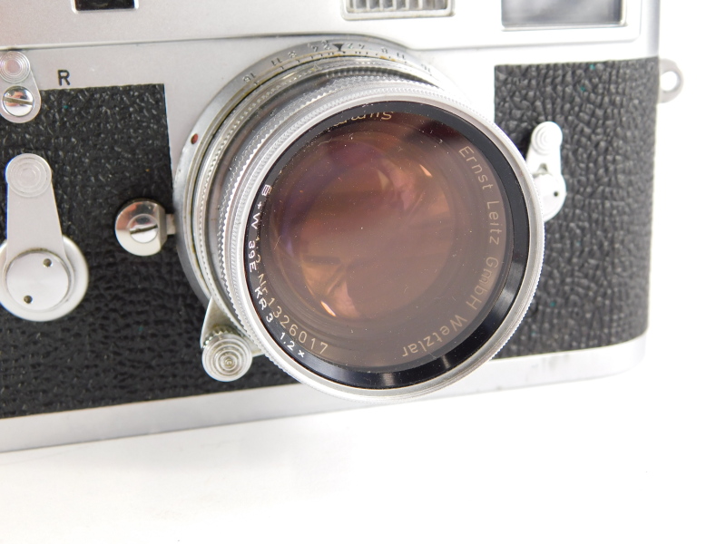 A Leica M2 camera, serial number 1069861, with a Leitz 5cm f2 Summicron lens, number 1326017. - Image 2 of 3