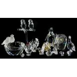 A collection of Swarovski Crystal birds, to include a penguin, two parrots on a perch, an owl, goose