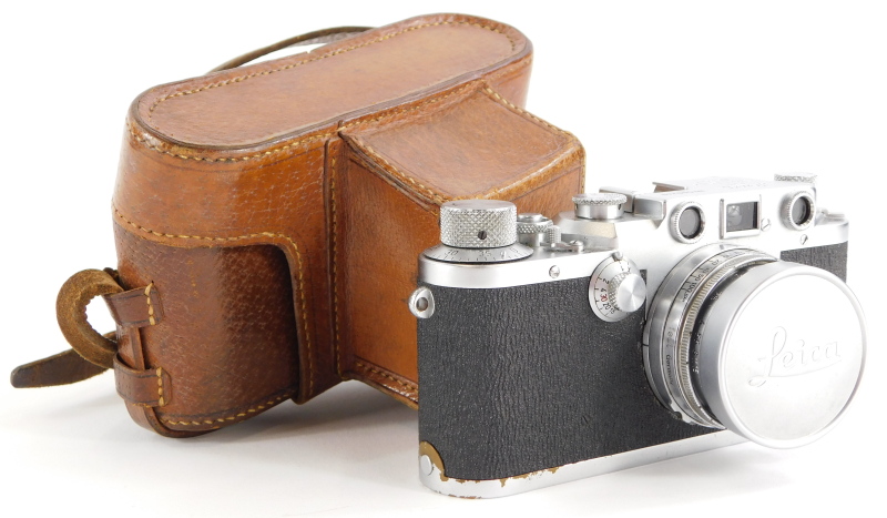 A Leica IIIc camera, serial number 500249, with a Leitz 5cm f2 Summitar lens, number 661835, in a le