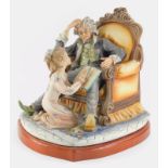 A large Capodimonte porcelain figure group, modelled in the form of a gentleman seated on a throne t