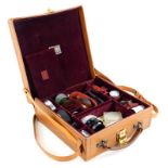 A tan bespoke pigskin suitcase, containing mixed Leica accessories.