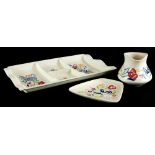 Three items of Poole pottery, to include a rectangular hors d'oeuvres tray, a tapering rectangular d
