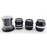 Four camera lenses to fit Nikon cameras, to include a Nikkor 18mm f3.5 super wide angle lens, a Nikk