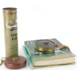 A collection of tennis related items, to include a lawn tennis measure in brass case, a leather case
