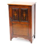 An Edwardian rosewood and marquetry music cabinet, the rectangular top with a moulded edge above a s