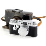 A Leica IIIG camera, serial number 981064, with a Leitz 5cm f2.8 Elmar lens, number 1619673, in a le