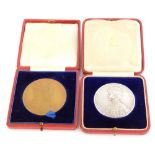 A 1911 coronation medal, silver, cased, and a 1902 coronation medal, cased.