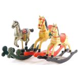 Three model miniature rocking horses, each with coloured enamel decoration, the largest 39cm long.