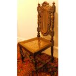 A 19thC oak and beech child's chair, with caned seat and back, in 17thC style.