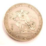 A George III crown 1819 coin.