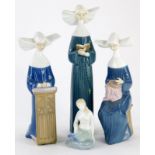 Various Lladro figures of nuns, one sewing, 21cm high, and another Lladro style figure of a mermaid,