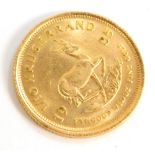 A South African 1/10th of a Krugerrand coin dated 1985.
