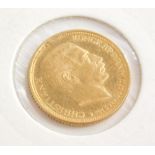 A 1912 gold Denmark ten krona coin, in presentation cardboard sleeve.