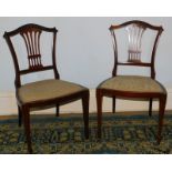 A pair of late Victorian bedroom chairs, with damask seats and pierced vase splats.