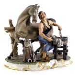 A Capodimonte porcelain figure of a blacksmith with a horse, on a rococo scroll base, 28cm wide.