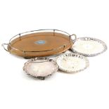 A late 19th/early 20thC oak oval two handled galleried tray, with silver plated mounts, 62cm wide, a