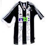 A Newcastle United football shirt from the season 2002/2003, bearing various signatures including Al