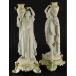A pair of late 19thC French porcelain figural candlesticks, stamped Brevete, (AF).