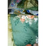 A quantity of textiles, to include a quilted bed cover, a velour bed cover, crewel work cover, etc.