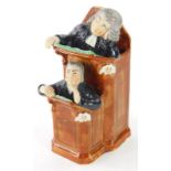 A Ralph Wood style pottery figure group, of 'The Vicar and Moses in the Pulpit', the reverse inscrib