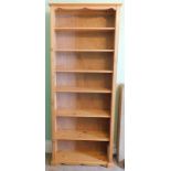 Withdrawn presale by vendor- A stripped pine open bookcase, 222cm high, 92cm wide.