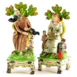 A pair of early 19thC Walton type Staffordshire figures, of 'Elijah' and 'Widow', 28cm high.