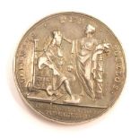 A coronation of George II silver medallion by J Croaker 1727.