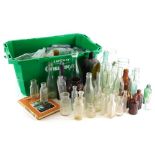 A quantity of excavated and other mineral and chemist bottles, a book on bottle collecting, etc. (2