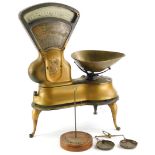 A set of W & T Avery Limited scales, with gilt decoration, enamel style register etc., 36cm wide, an