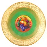 A Bishop handpainted dish, signed W. Burbeck, decorated with summer fruits, with an outer gilt bandi