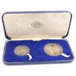 Two commemorative 1969 Prince Charles medallions, cased.