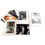 A collection of film photographs, bearing signatures of Nick Nolte, Jackie Chan, Dustin Hoffman, Dav