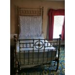 A Victorian brass double bed stead, with mother of pearl embellishments.