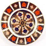 A Royal Crown Derby Imari pattern side plate, pattern number 1128, printed marks in red struck throu