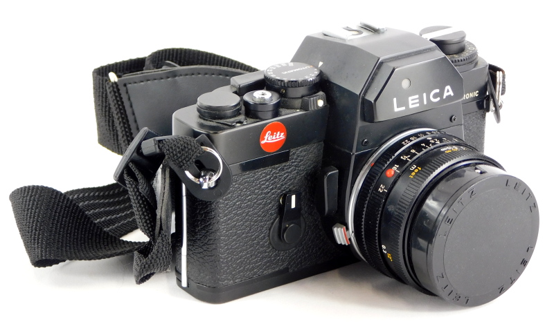 A black Leica R3 single lens reflex camera, with a Leitz 28mm f2.8 Elmarit R wide angle lens, number