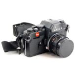 A black Leica R3 single lens reflex camera, with a Leitz 28mm f2.8 Elmarit R wide angle lens, number