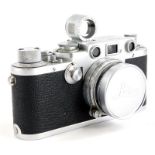 A Leica IIIf camera, serial number 608750, bearing engraved name Tahir to back, with a Leitz 5cm f2