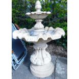 A composition two tier fountain, cast with shells, leaves, etc., on a tapering base, 133cm high, 90c