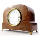 An early 20thC mahogany and marquetry mantel timepiece, the enamel dial stamped France, on brass bra