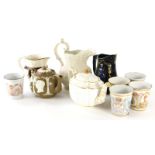 Two royal commemorative teapots, five enamel Victoria and later mugs, and various jugs to include Ge