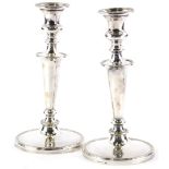 A pair of silver plated candlesticks, of tapering form with beaded borders, 25.5cm high.