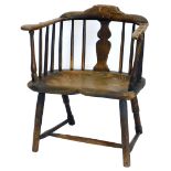 A late 18th/early 19thC rustic ash and elm Windsor type chair, with a shaped back, and a solid splat