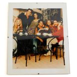 A photograph of the cast of Friends, bearing signatures.