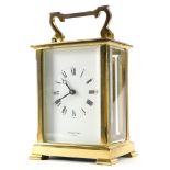 A brass carriage clock by Shortland Bowen, with bevelled glass sides, the movement stamped Made In E