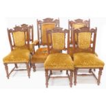 A late Victorian walnut salon suite, comprising of gentleman's, ladies and four open armchairs, with