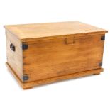 A stripped pine blanket box, with metal brackets, lock removed on a plinth, 79cm wide.