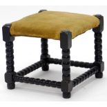 A stained oak stool, with bobbin turned decoration and a padded seat, 34cm wide.