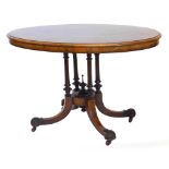 A Victorian walnut and marquetry loo table, with oval top cross banded with amboyna and ebonised pan