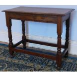 An oak table, in 17thC style with moulded top, shaped frieze, turned legs and plain stretchers, 84cm