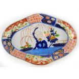 An early 19thC Coalport Imari style oval dish, 28cm. (AF)